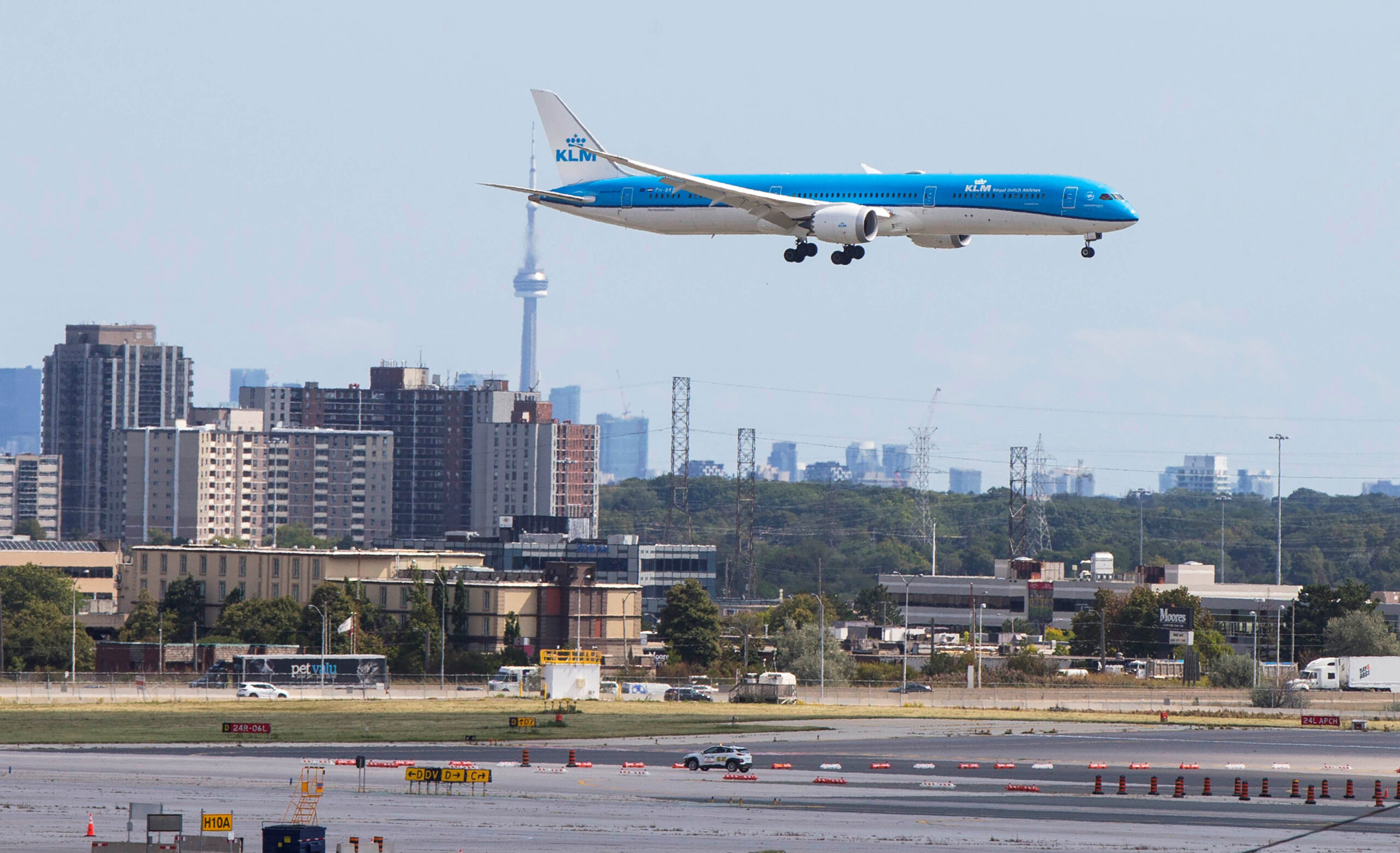 Canada is launching a standardized proof of vaccination credential for both domestic and international travel. An airplane is seen landing in Mississauga