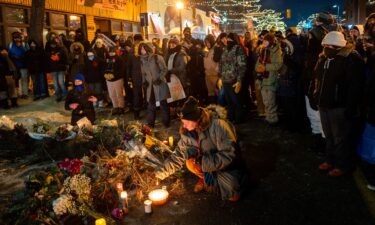 An image of Alex Pretti is seen at a makeshift memorial in the area where he was shot dead by federal immigration agents in Minneapolis